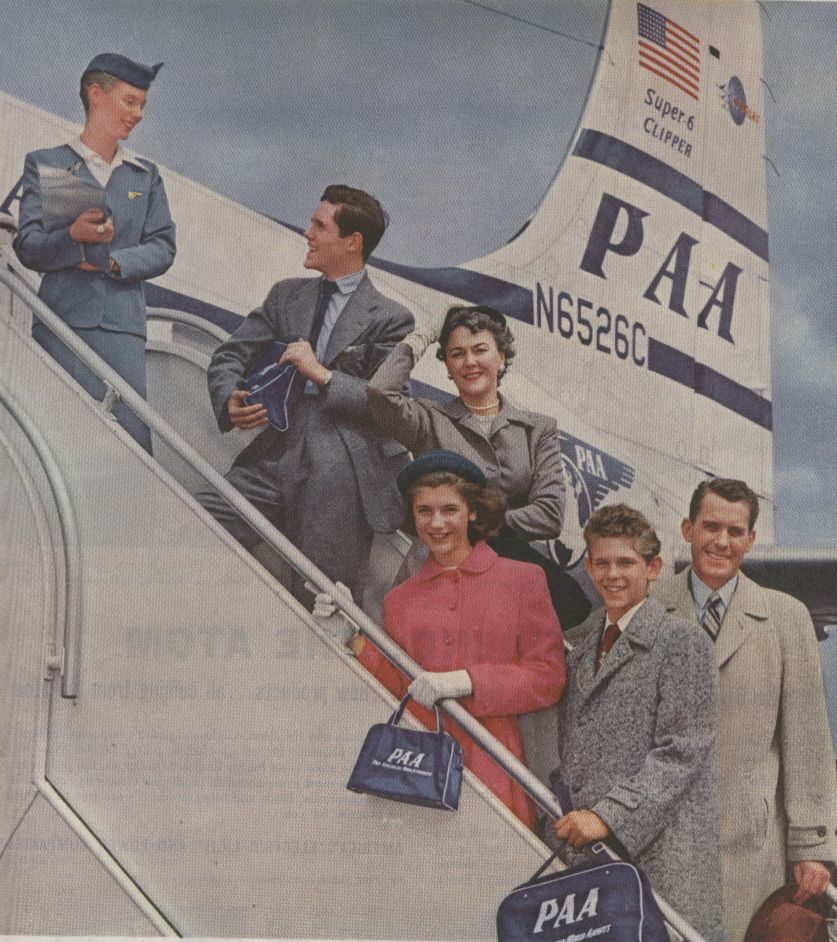 1950s  Family posing on steps of a Pan Am DC6 Clipper.
